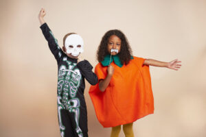 cheerful children with halloween costume scaled 1