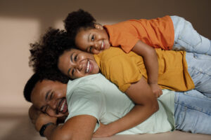 medium shot black family posing studio scaled 1