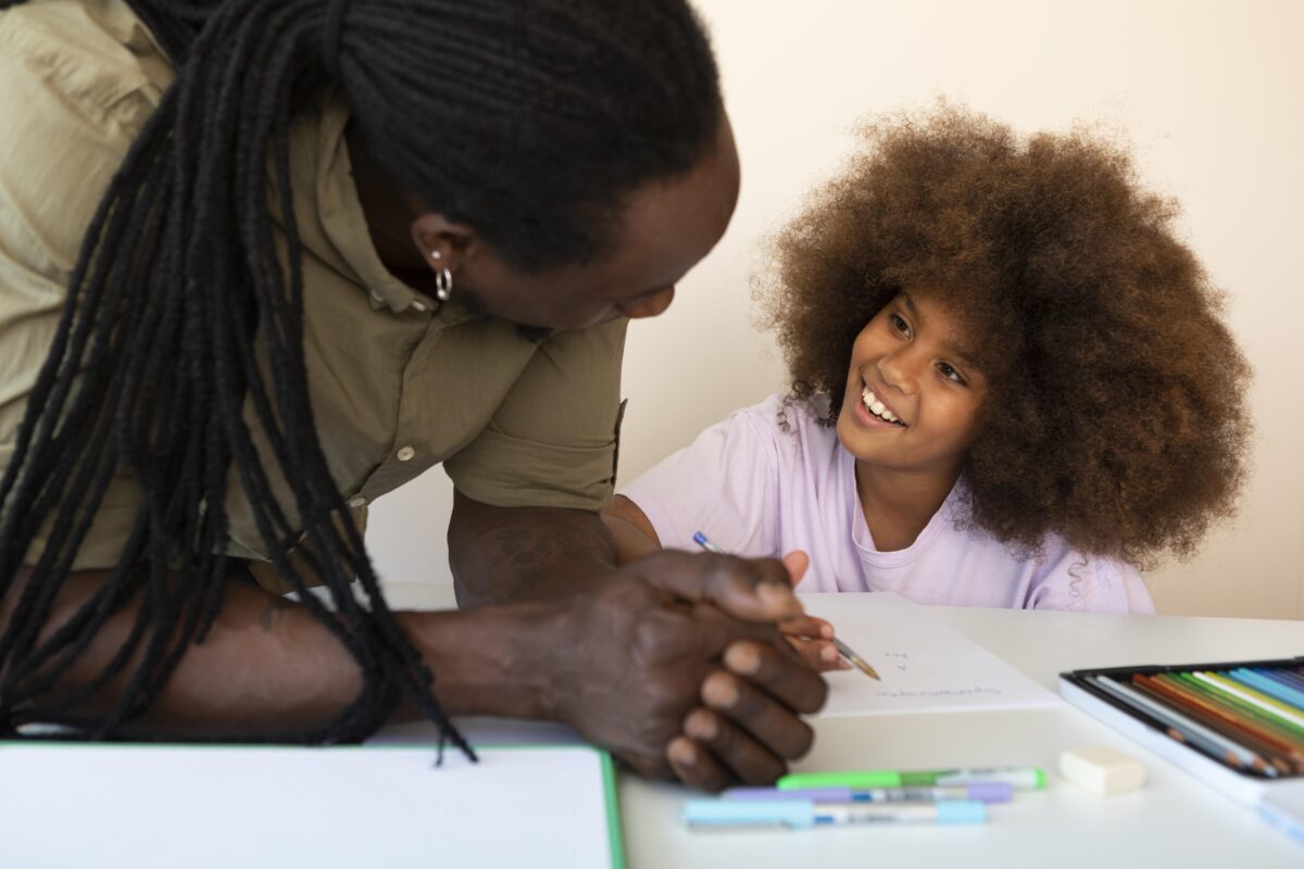 father helping his daughter with homework 1