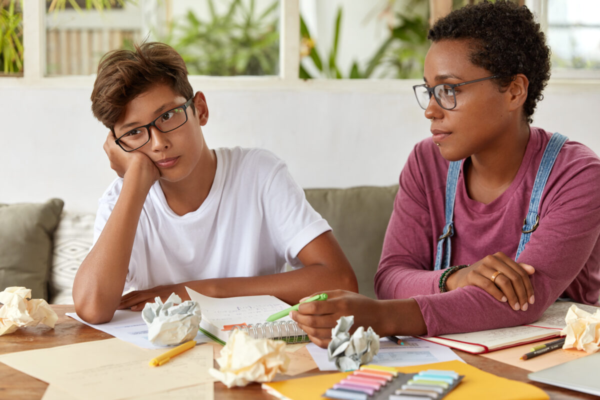 multiracial teenagers homework together