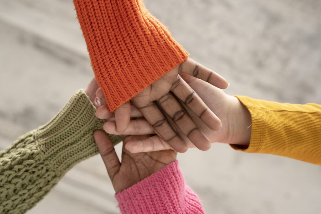 close up women hands holding each other