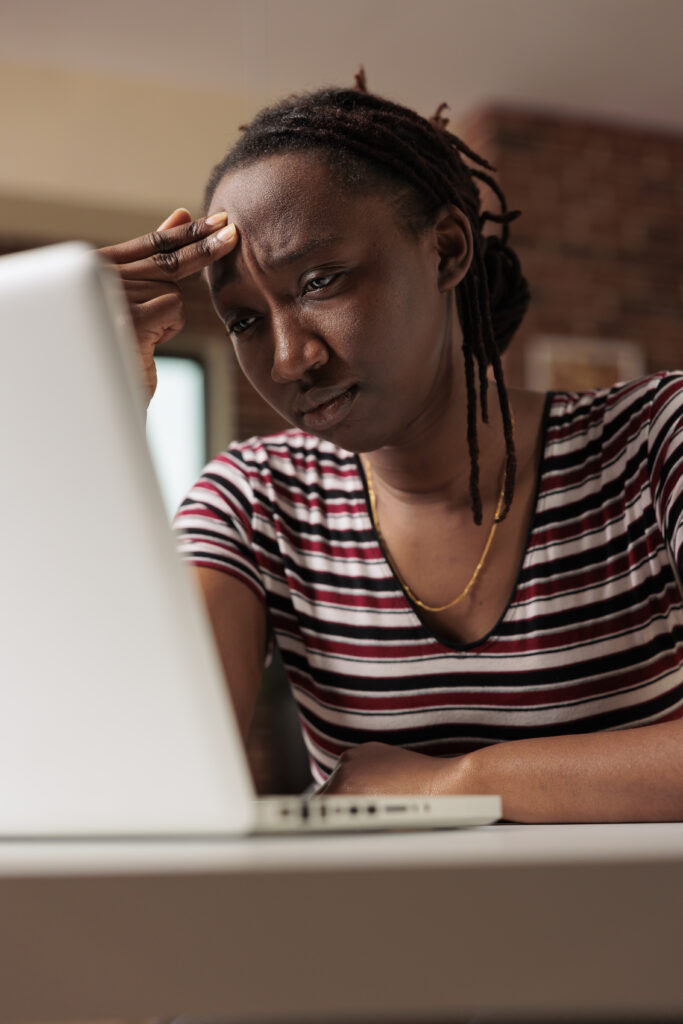 stressed tired student having migraine looking laptop screen suffering from headache symptom rubbing forehead exhausted remote worker feeling unwell unhappy freelancer working 1